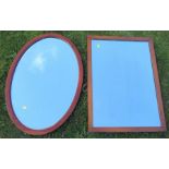 Two wooden framed wall mirrors