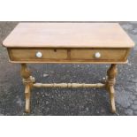 An Antique pine wash stand, fitted with two frieze drawers, on end supports united by a stretcher,