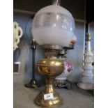 Two oil lamps and a table lamp