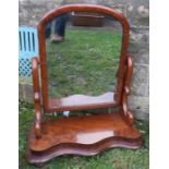 A 19th century mahogany swing frame dressing table mirror, on shaped supports and base