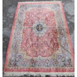An Eastern design silk rug, with pink ground, 84ins x 54ins