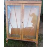 An Art Deco style two door display cabinet, raise don short cabriole legs, width 36ins, height 49.