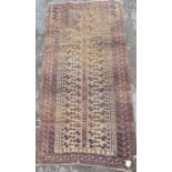 33013 - An Eastern style prayer mat, in brown and orange, 68ins x 34ins