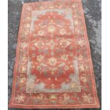 A modern Chinese rug, decorated with flowers, 60ins x 36ins