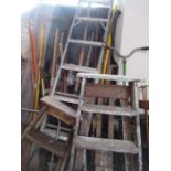 A large collection of garden tools, ladders, etc.