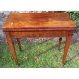 A 19th century mahogany fold over card table, of rectangular form, raised on square tapering legs