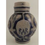 An 18th century Queen Anne Westerwald salt-glazed stoneware ale jug, the body with central sprig