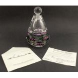 A Vandermark Merritt limited edition scent bottle, the facetted case containing violet flowers,