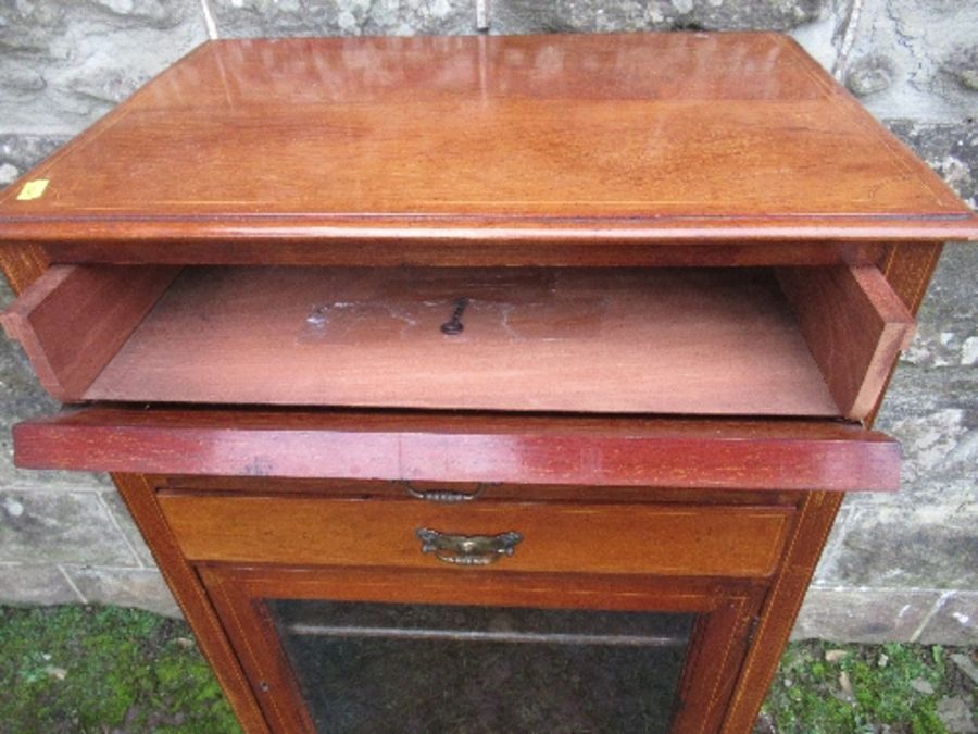 An Edwardian music cabinet, with three drop down drawers, over a glazed door, raised on tapering - Image 5 of 7