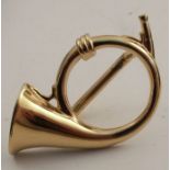 A Paris scarf ring, formed as a French horn, in gilt metal
