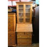 A modern pine bureau bookcase, width 32ins x depth 18ins x height 72ins