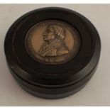 A 19th Century Bois Durci snuff box, with Lord Nelson Profile inset into the cover, the snuff box