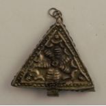 A Ghanaian Ashanti triangular silver amulet, height 2ins