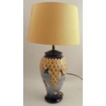 A Moorcroft pottery table lamp, the baluster shaped body decorated in the Honeycomb pattern,