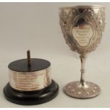 A Victorian silver trophy cup, with embossed decoration and presentation inscription, London circa