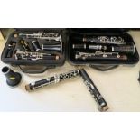 A box to include two cased Selmer Omega clarinets, together with another loose clarinet, and