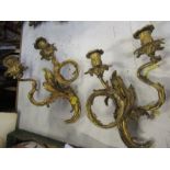 A pair of 19th century design metal wall sconces, of floral scrolled form