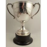 A large silver two handled trophy cup, with presentation inscription, London 1909, weight 21oz