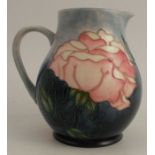 A Moorcroft collectors club jug, decorated with flowers 5.25ins