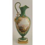 A Royal Worcester ewer, with green ground, decorated with a reserve of a Continental landscape of