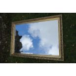 A modern gilt framed mirror with bevelled mirror plate, 35ins x 23ins