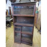 A four section Globe Wernicke bookcase, width 34ins x depth 11ins x height 62ins