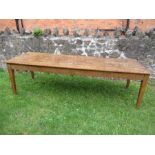 A large elm/oak farmhouse or refectory table, having six plank top, fitted with a short drawer to