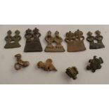Nine Cote D'Ivoire Senufo assorted cast metal protective amulets