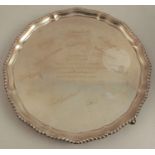 A silver salver, with gadrooned shaped edge, the centre engraved with a presentation inscription for
