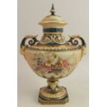 A Royal Worcester blush ivory and green covered vase, decorated with floral sprays, raised on a