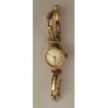A lady's 9 carat gold Carronade mechanical wrist watch on a bracelet