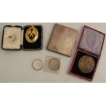A Monmouthshire masonic pendant, in a fitted case, together with a silver cigarette case,