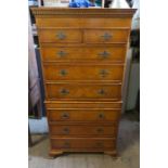 A reproduction pollard oak chest on chest, the upper section fitted with two short drawers over