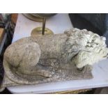 A stone garden model of a recumbent lion, width 16ins x 7.5ins high