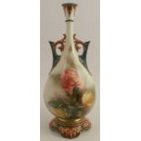 A Hadleys Worcester vase, decorated with roses, with green and brown handles and base, height 9.5ins