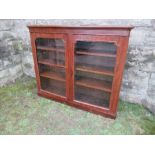 A Victorian style mahogany glazed cabinet, the doors opening to reveal shelves, width 54ins x