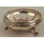 A Mappin & Webb circular silver bowl, with pierced edge, raised on three claw and ball feet,