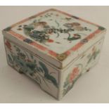 An 18th century Chinese Kangxi covered box, of square form, with lotus and aster floral