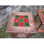A pair of Art Nouveau tile top occasional tables, raised on four outswept legs united by a