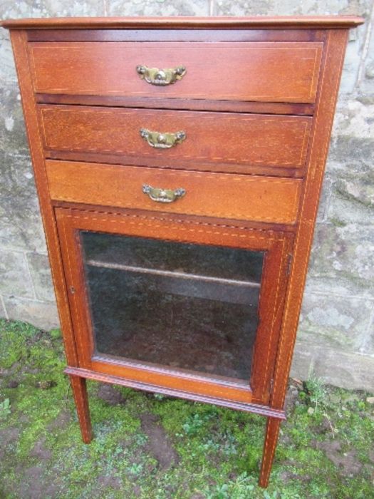 An Edwardian music cabinet, with three drop down drawers, over a glazed door, raised on tapering - Image 3 of 7