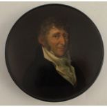 A Georgian black papier mache snuff box, painted with a portrait of a gentleman, inscribed to the