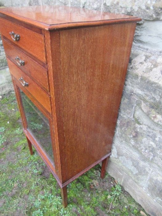 An Edwardian music cabinet, with three drop down drawers, over a glazed door, raised on tapering - Image 7 of 7