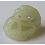 A miniature jade carving, of a bird, chick and foliage, height 1.5ins - good condition, no chips