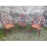 A pair of 19th century yew wood Windsor armchairs (one with arm missing), with pierced and roundel