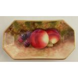 A Royal Worcester pin dish, of rectangular form with canted corners, painted with fruit to a mossy