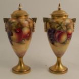 A pair of Royal Worcester covered vases, decorated with hand painted fruit by Smith, shape number