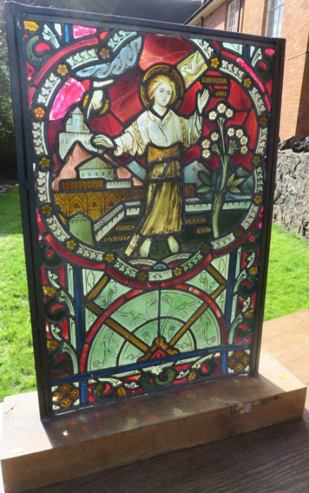 A 19th century stained glass panel, of rectangular form, depicting a saint, on an oak base, size