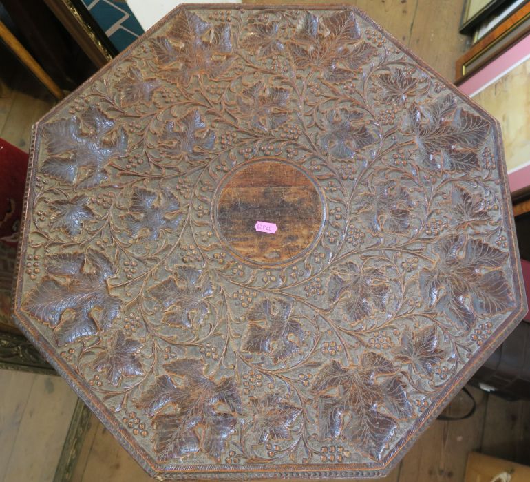 A carved Eastern octagonal table, with folding base, diameter 24ins, height 25ins - Image 2 of 4