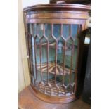 A 19th century hanging corner cupboard, with astragal glazed door, opening to reveal fitted