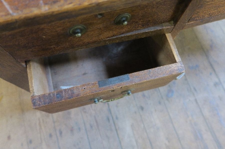 An early 20th century oak desk of rectangular form, fitted with one central drawer above a kneehole, - Image 4 of 4